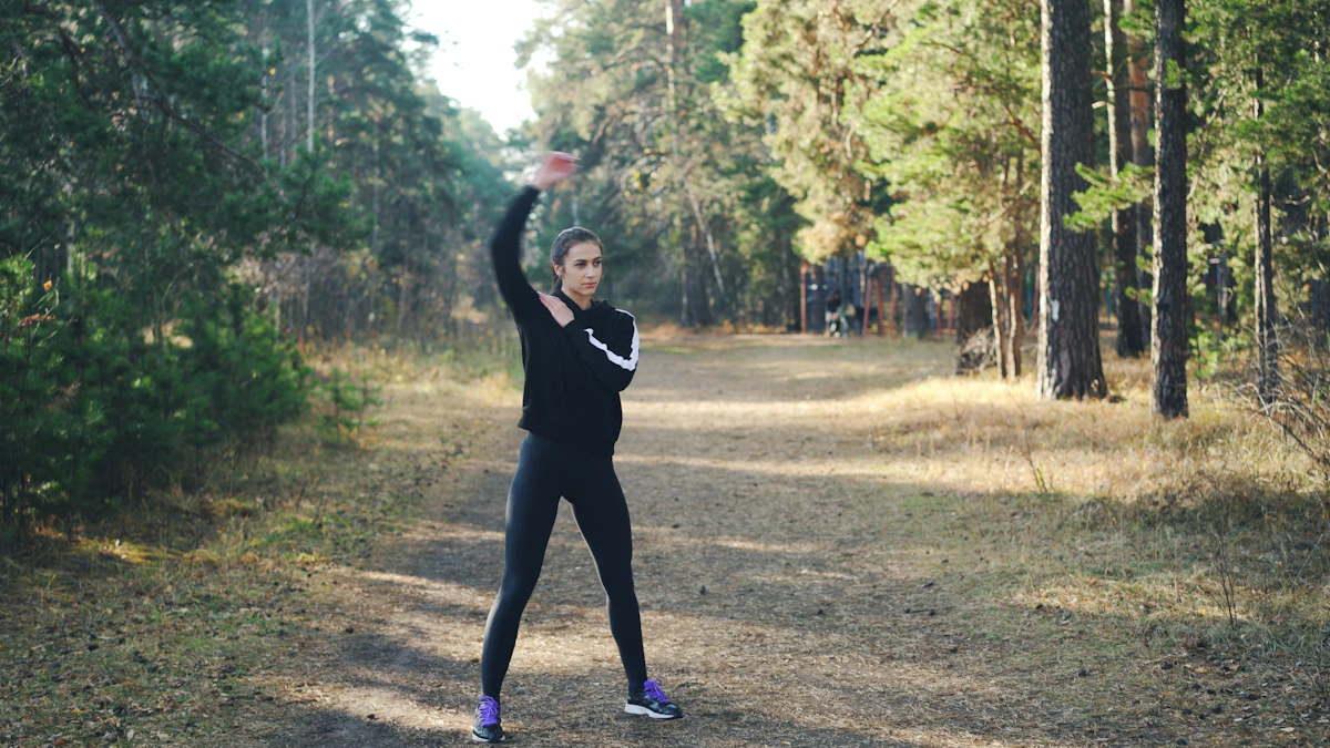 Woman stretching on a forest path