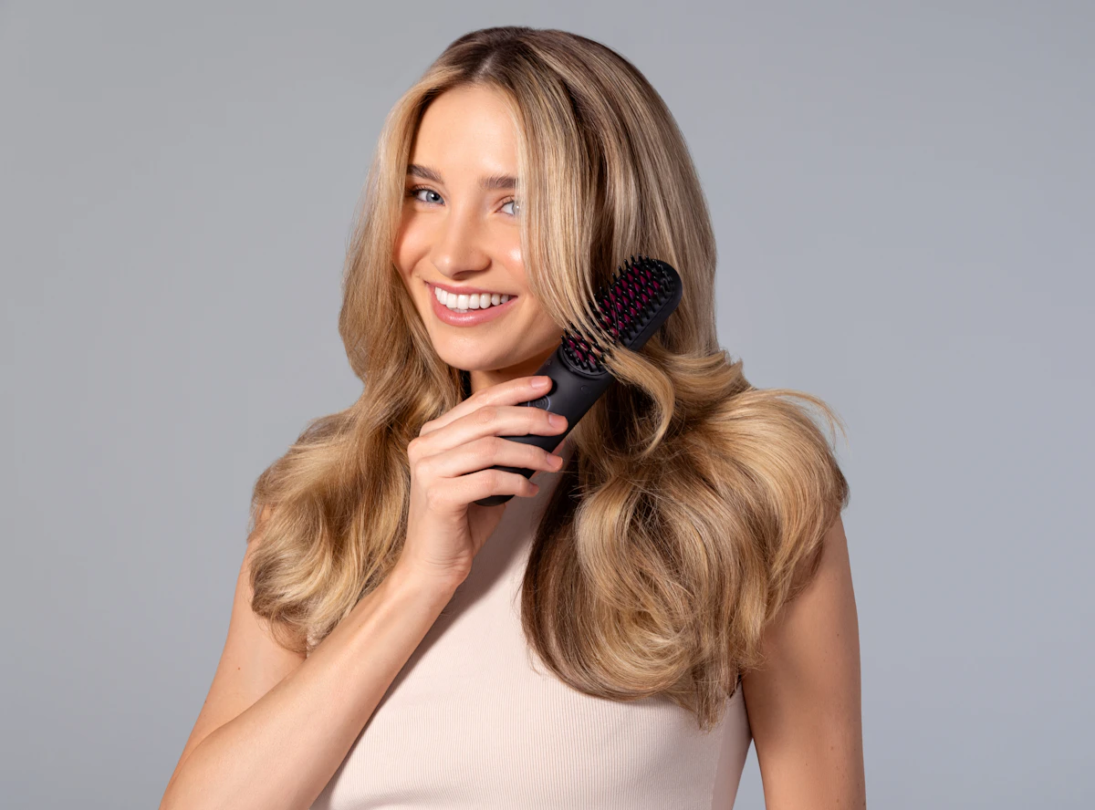 A woman holding a hair brush