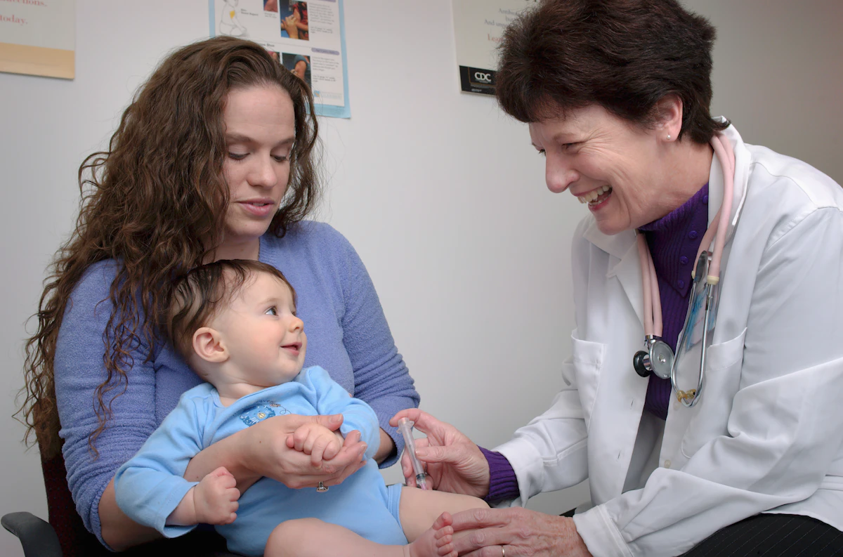 A young child being examined by a doctor