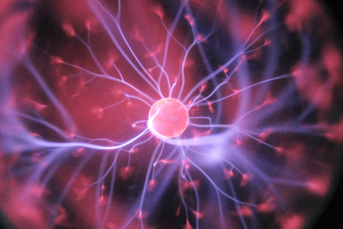 Purple and pink plasma ball resembling a neuron