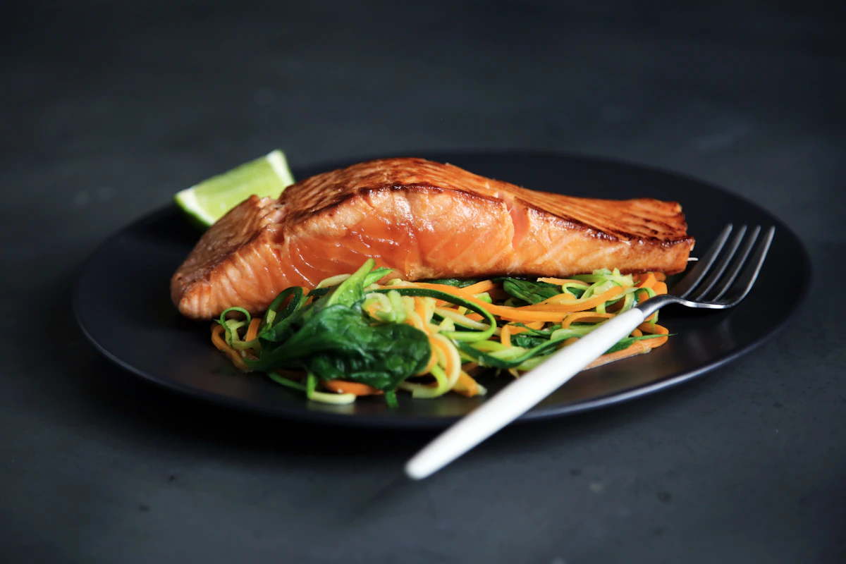 Grilled fish with cooked vegetables