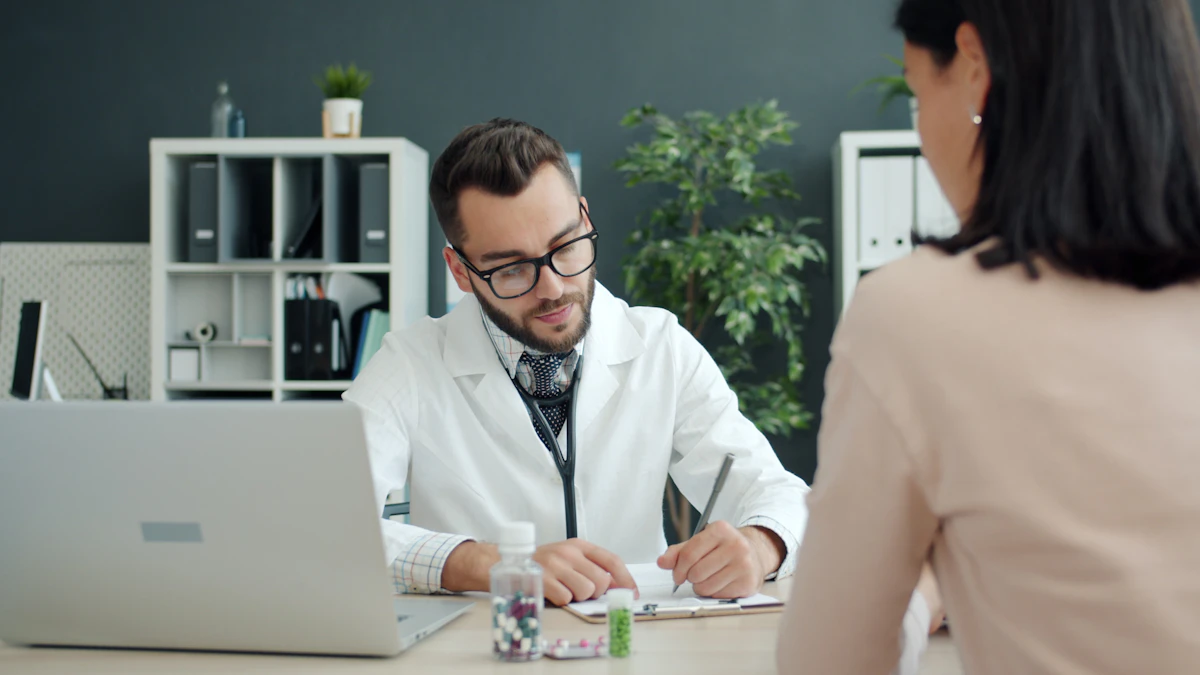 Doctor writing notes while the patient sits opposite